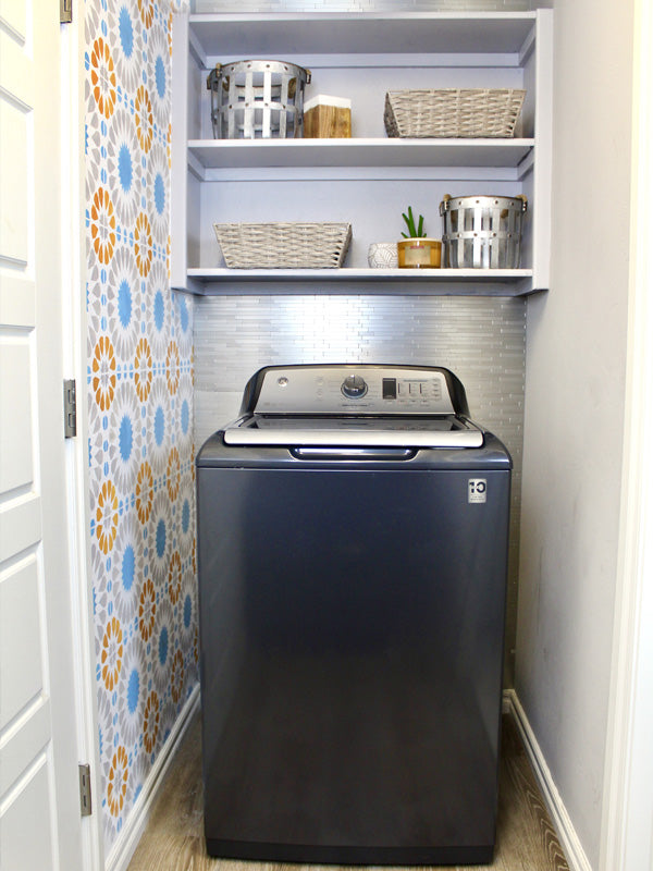Laundry Room Makeover featuring a wall stencil, vinyl flooring and peel and stick tile